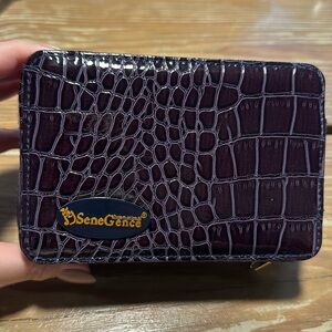 Senegence cosmetic clutch and lip sense